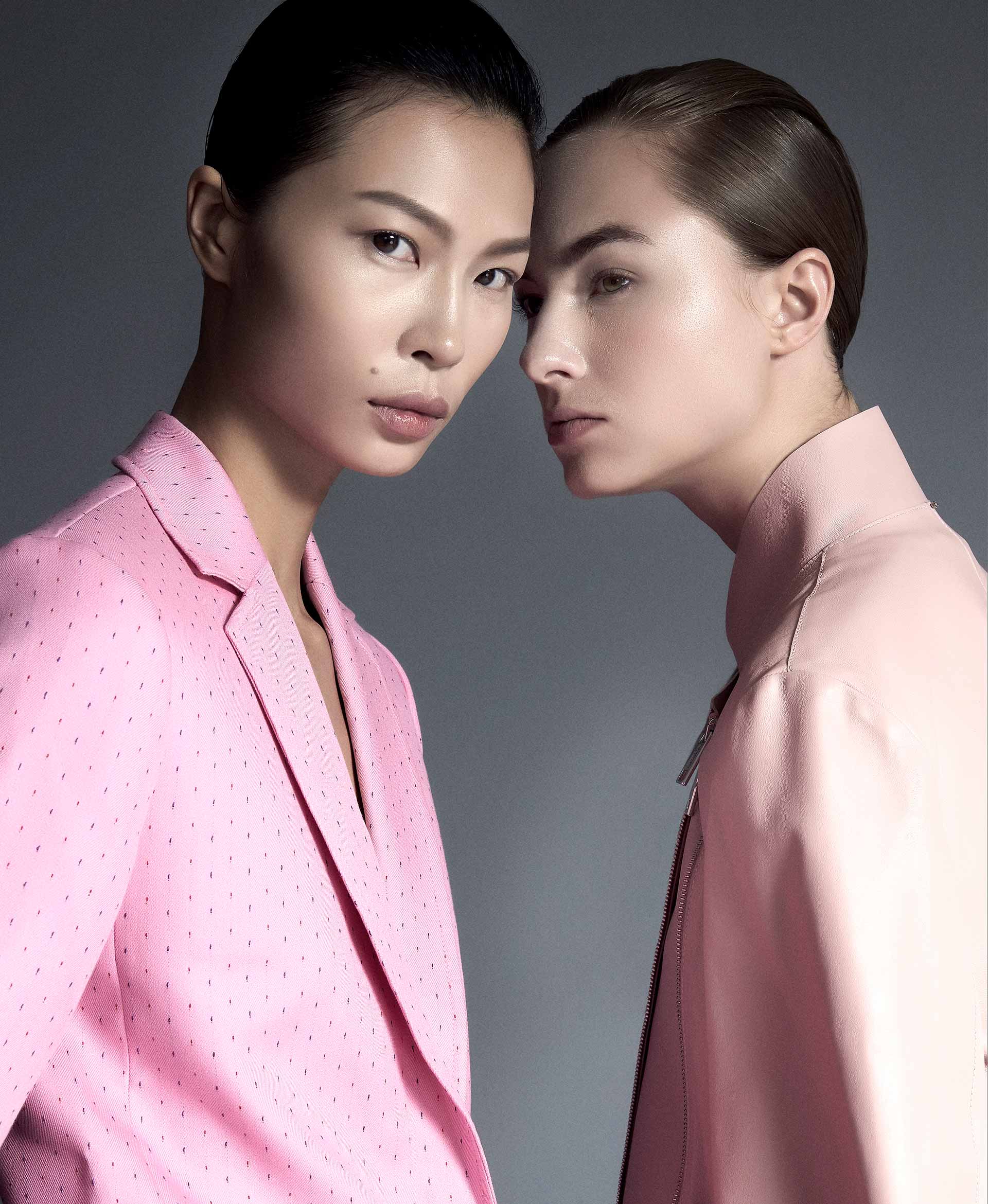 Two models go matching in pastel pink jackets from Sandro and Sportmax