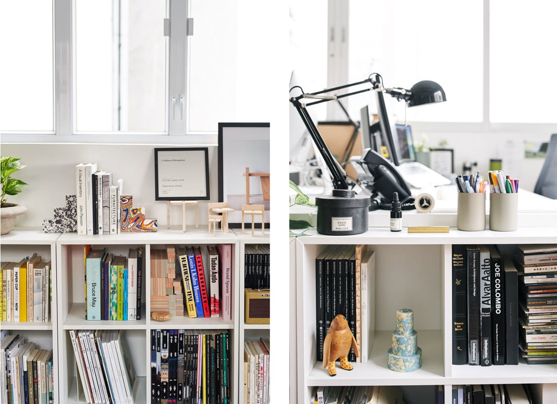 A shelf displays books and knick-knacks, including Tom Dixon’s Swirl Stepped Candle Holder and Swirl Bookend