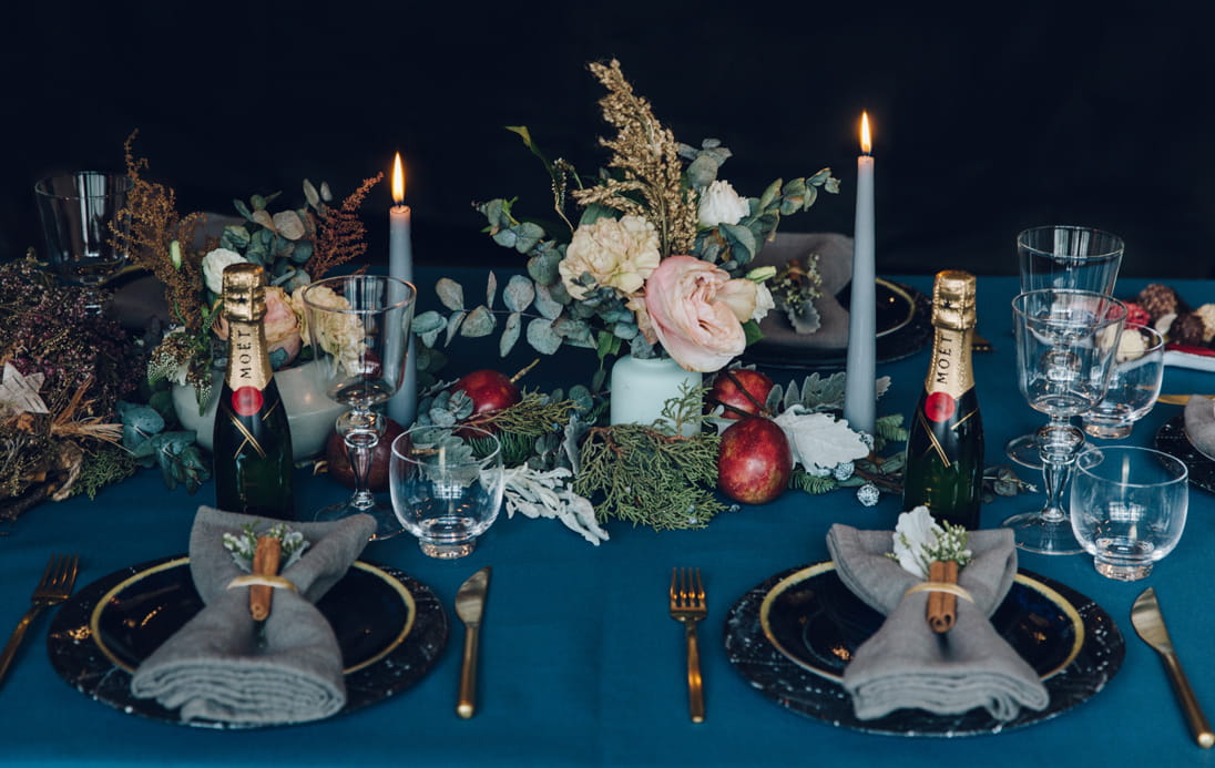Candles and flowers are the focal points of the tablescape