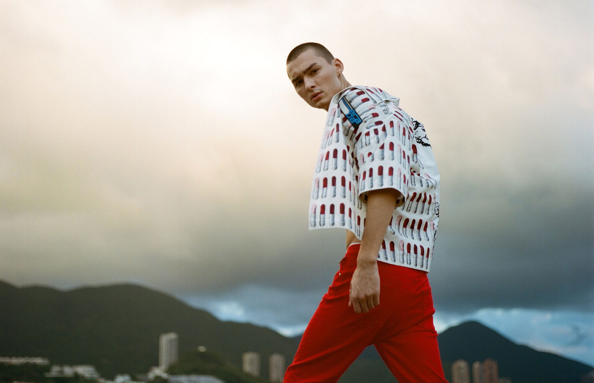 Model pairs a printed Prada shirt with trousers from Zadig & Voltaire