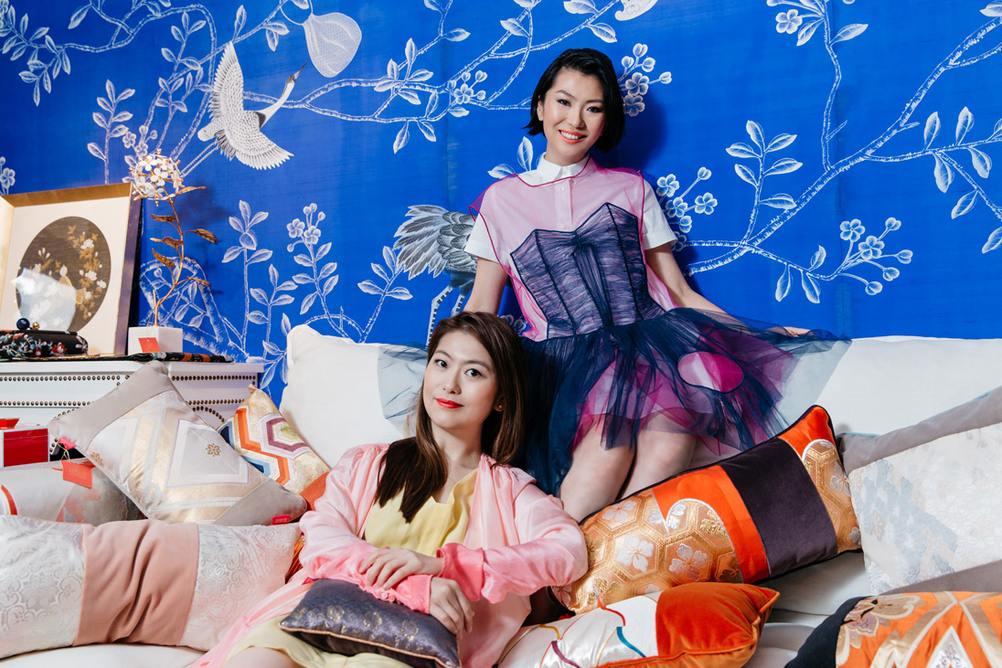 Anne (left) wears Dries Van Noten wrap dress, Laura (right) wears Sacai shirt dress and Viktor & Rolf tulle dress, available at Joyce Boutique. Home furnishings and wallpaper available at LALA CURIO
