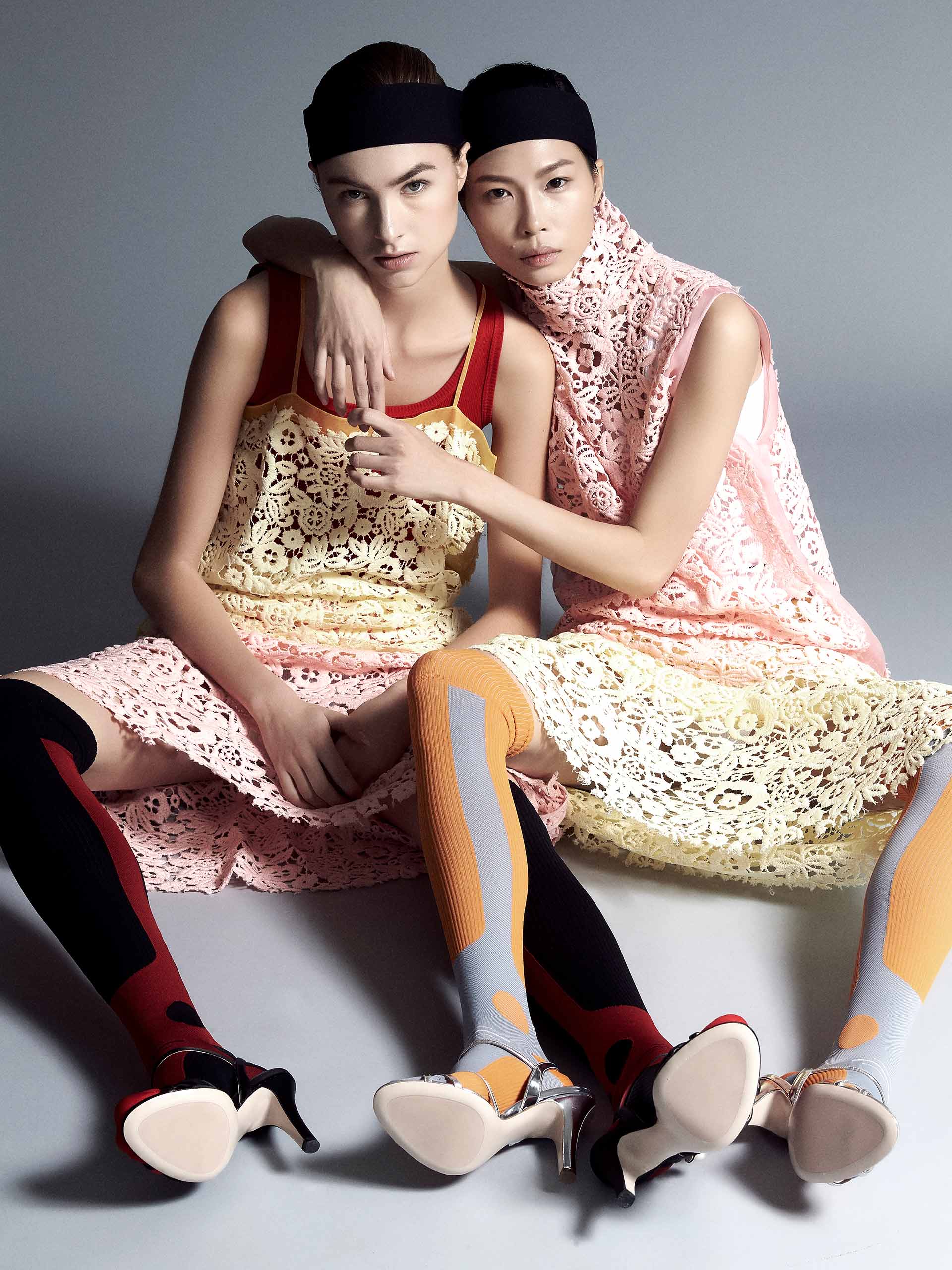 Two models go matching in pastel pink jackets from Sandro and Sportmax