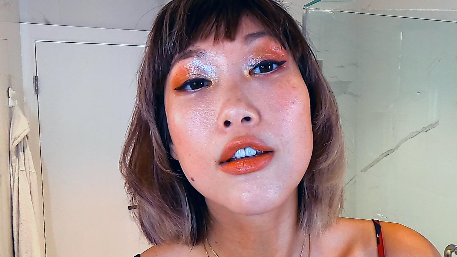 Model Angie Ng does a make-up tutorial video