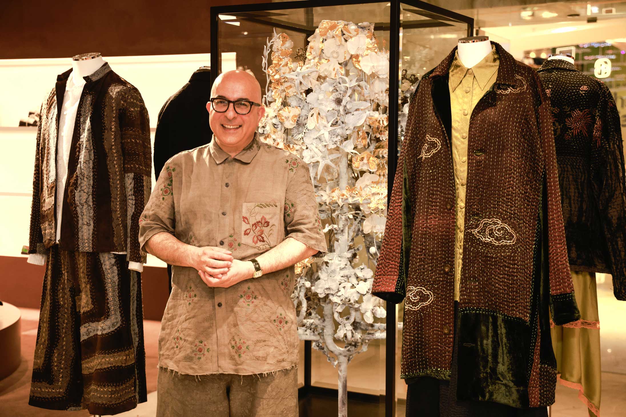 Fashion designer Walid al Damirji with some of his collection