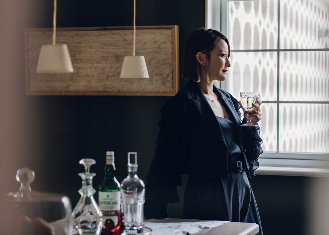 Maison Es chef Esther Sham in her well-stocked bar area