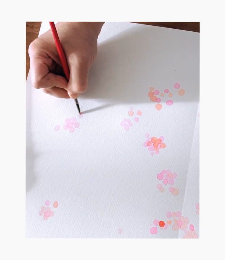 An artist creating a Chinese New Year calligraphy couplet