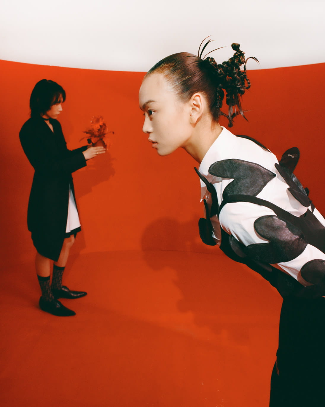 Models pose in Dior, Kimhekim, Versace and Miu Miu