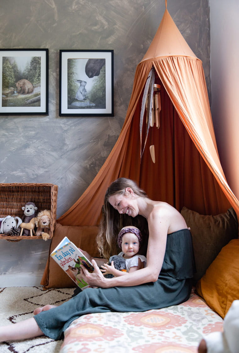 Cecilie Kock Larsen shares a moment with her daughter in a tepee