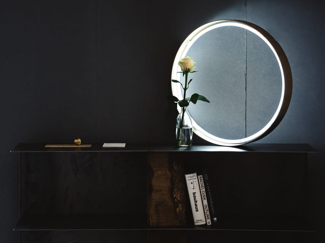 A bookshelf and mirror in creative studio Batten & Kamp
