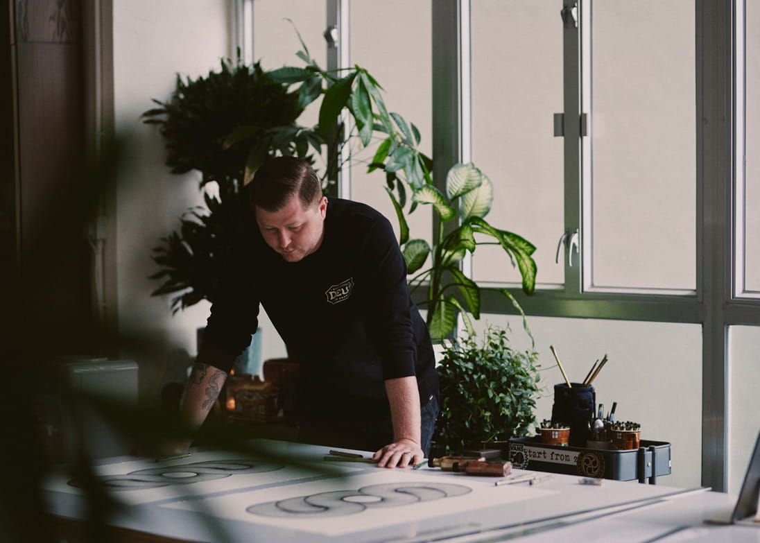 Hong Kong artist Peter Yuill works on a piece