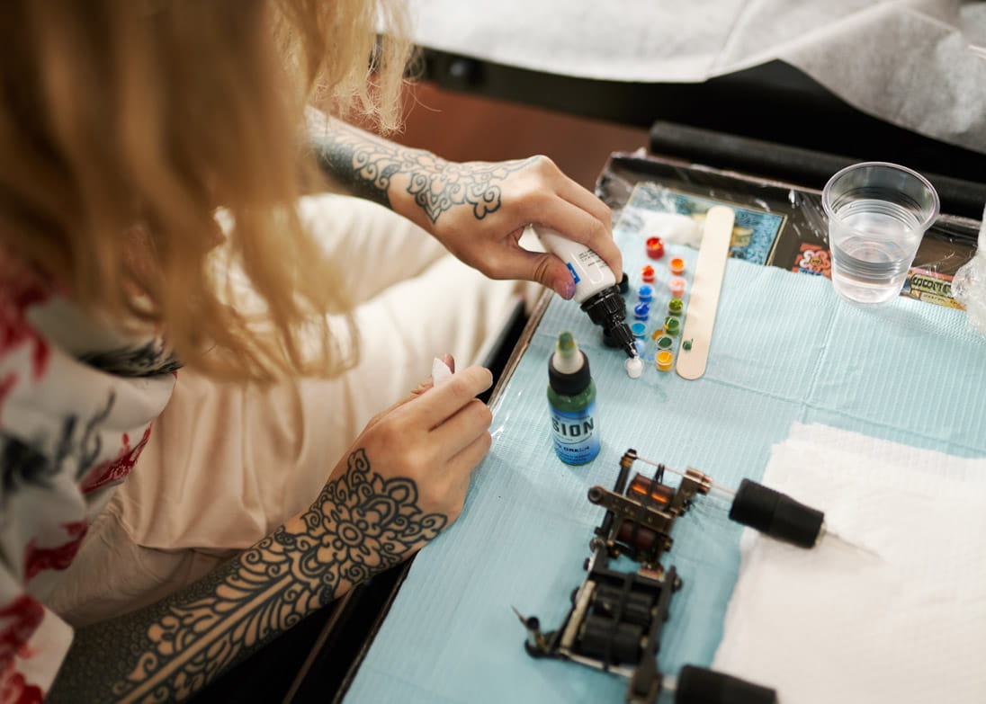 Chu mixes inks for her tattoos