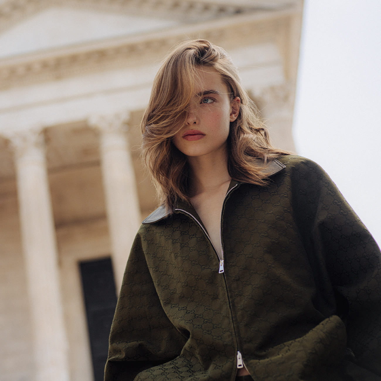A model poses in Nîmes wearing Gucci