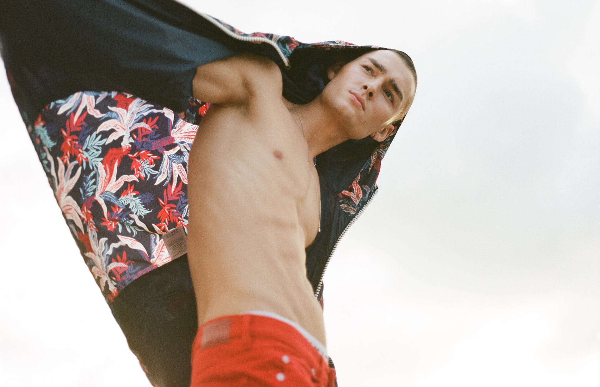 Model shows off a hooded, printed Moncler jacket