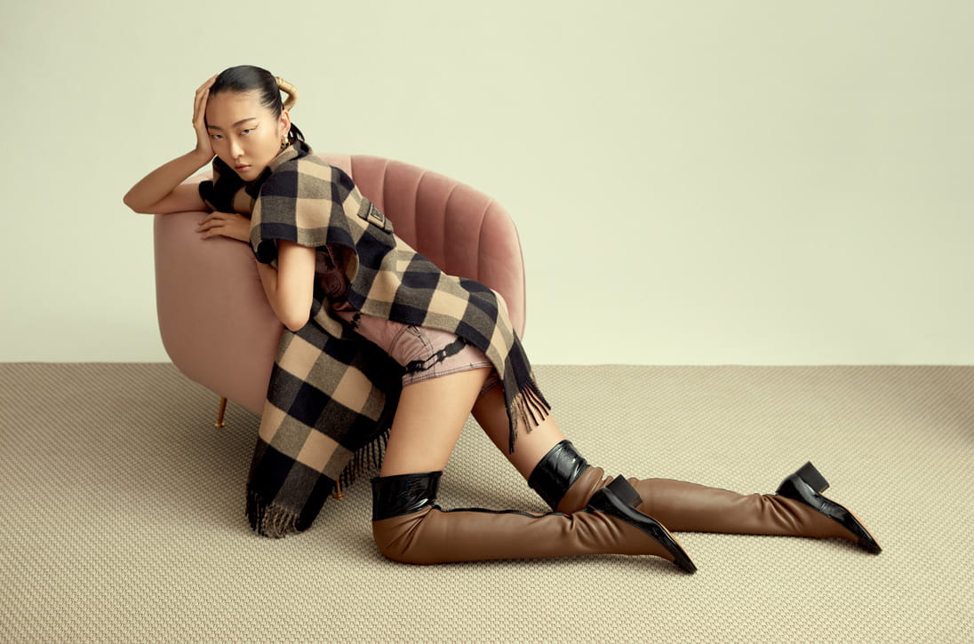 A model poses in Dior and LOEWE