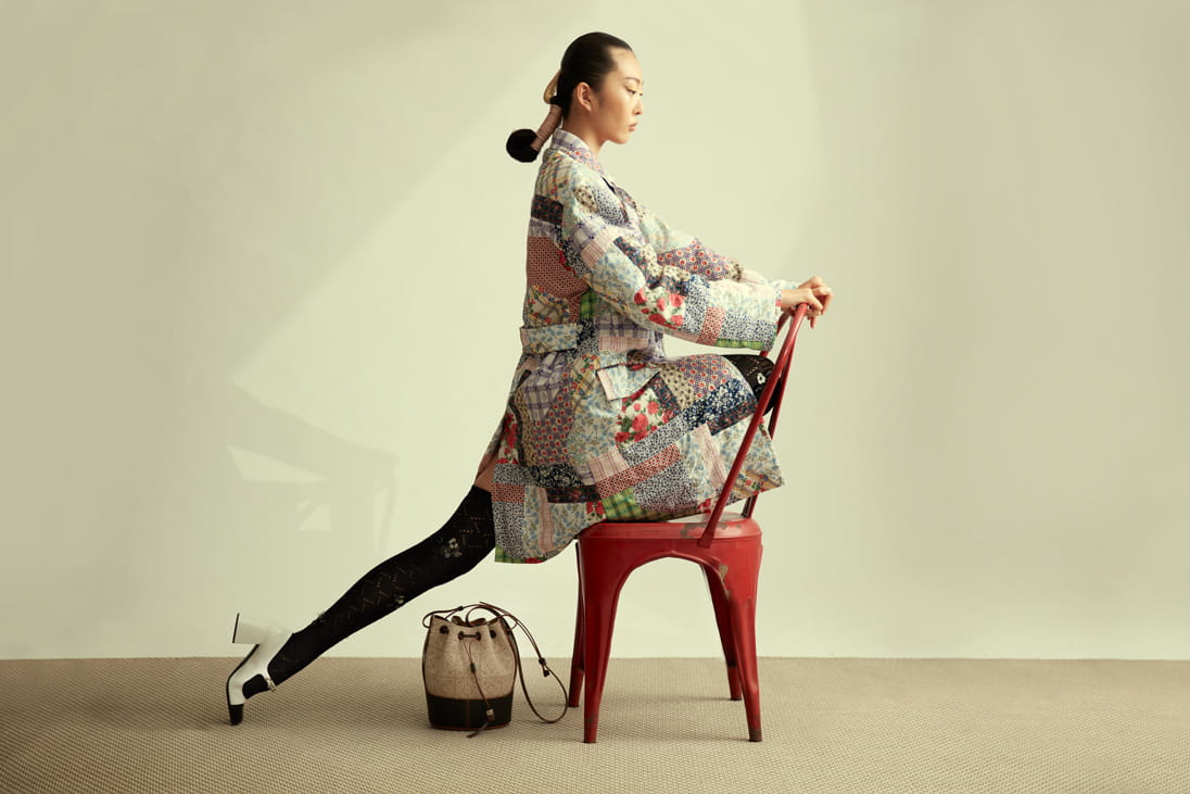 A model poses in Miu Miu and LOEWE