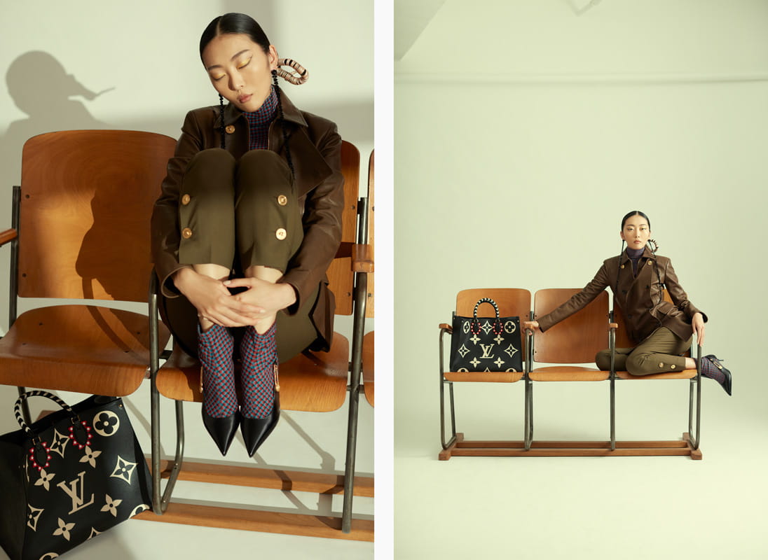 A model poses in Louis Vuitton, Versace and Simone Rocha
