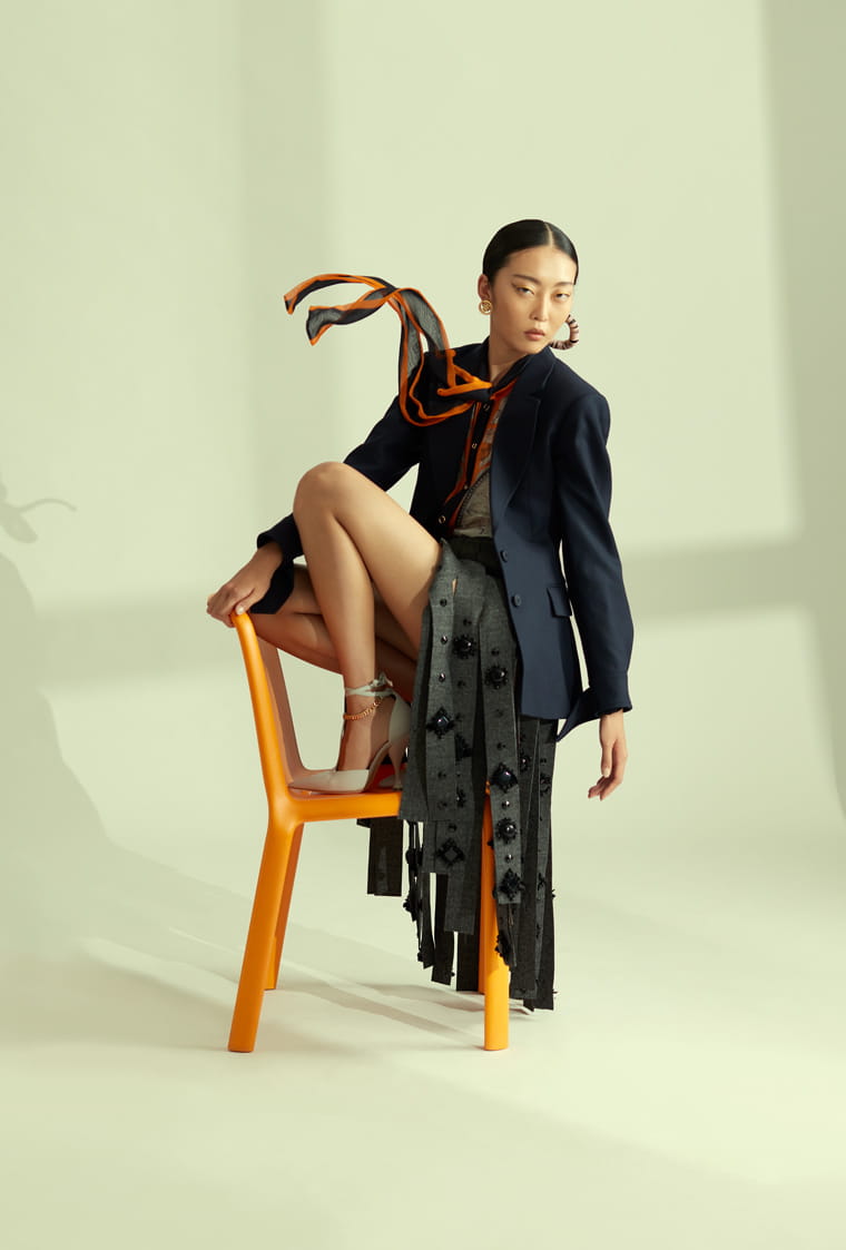 A model poses in Chloé, Prada, Burberry and Versace 