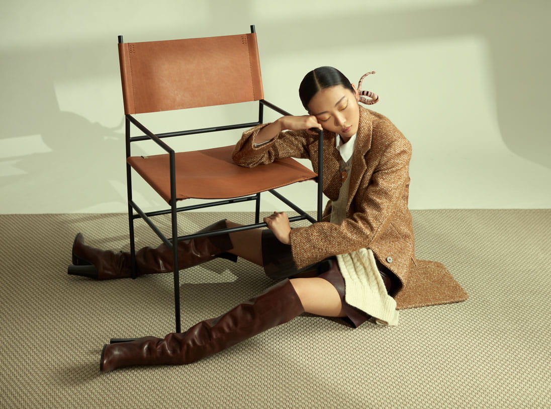 A model poses in Louis Vuitton, Simone Rocha, Chloé and Celine