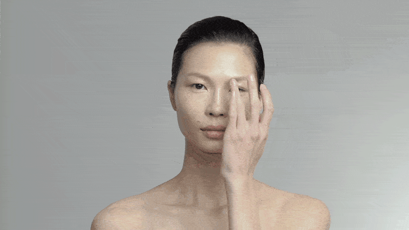 A girl smearing Vaseline in her face