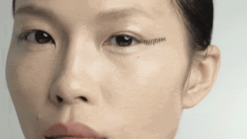 A girl wears professional eye make-up