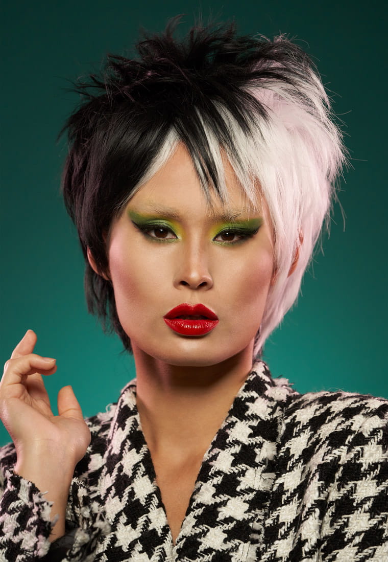 A model made up as Cruella de Vil from 101 Dalmatians