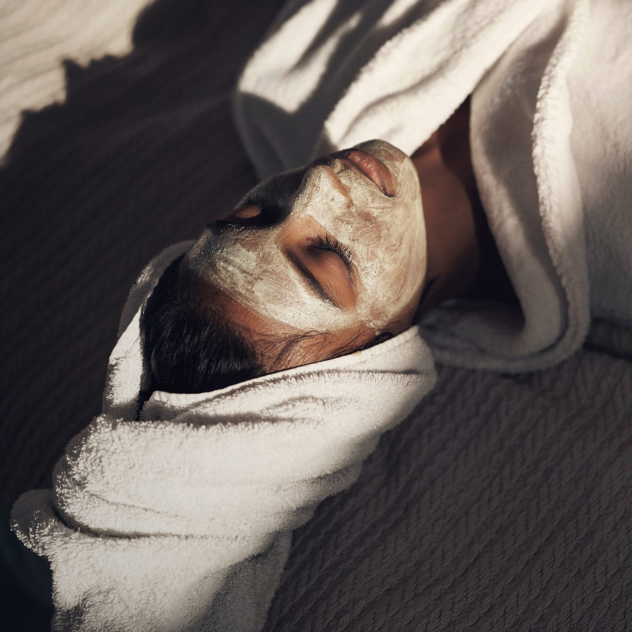 A woman doing a home facial