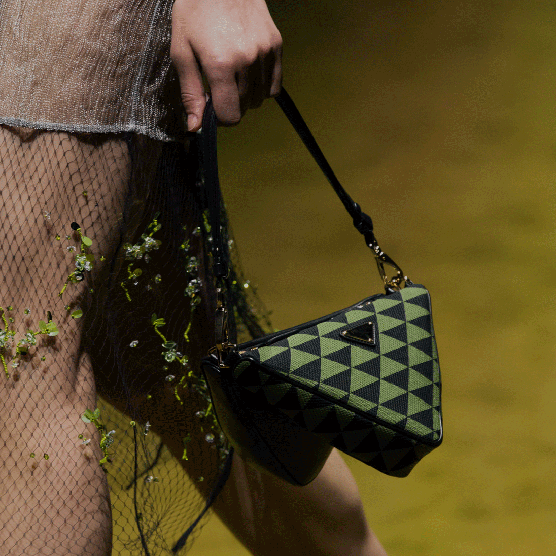 A model holding a Prada bag available at Pacific Place