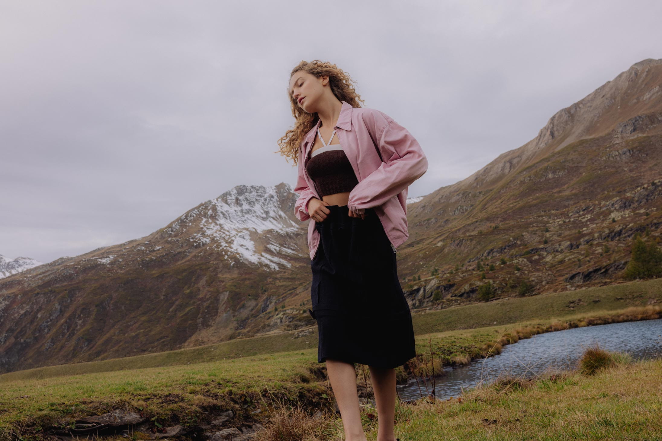 A model poses wearing Prada in the Italian Alps