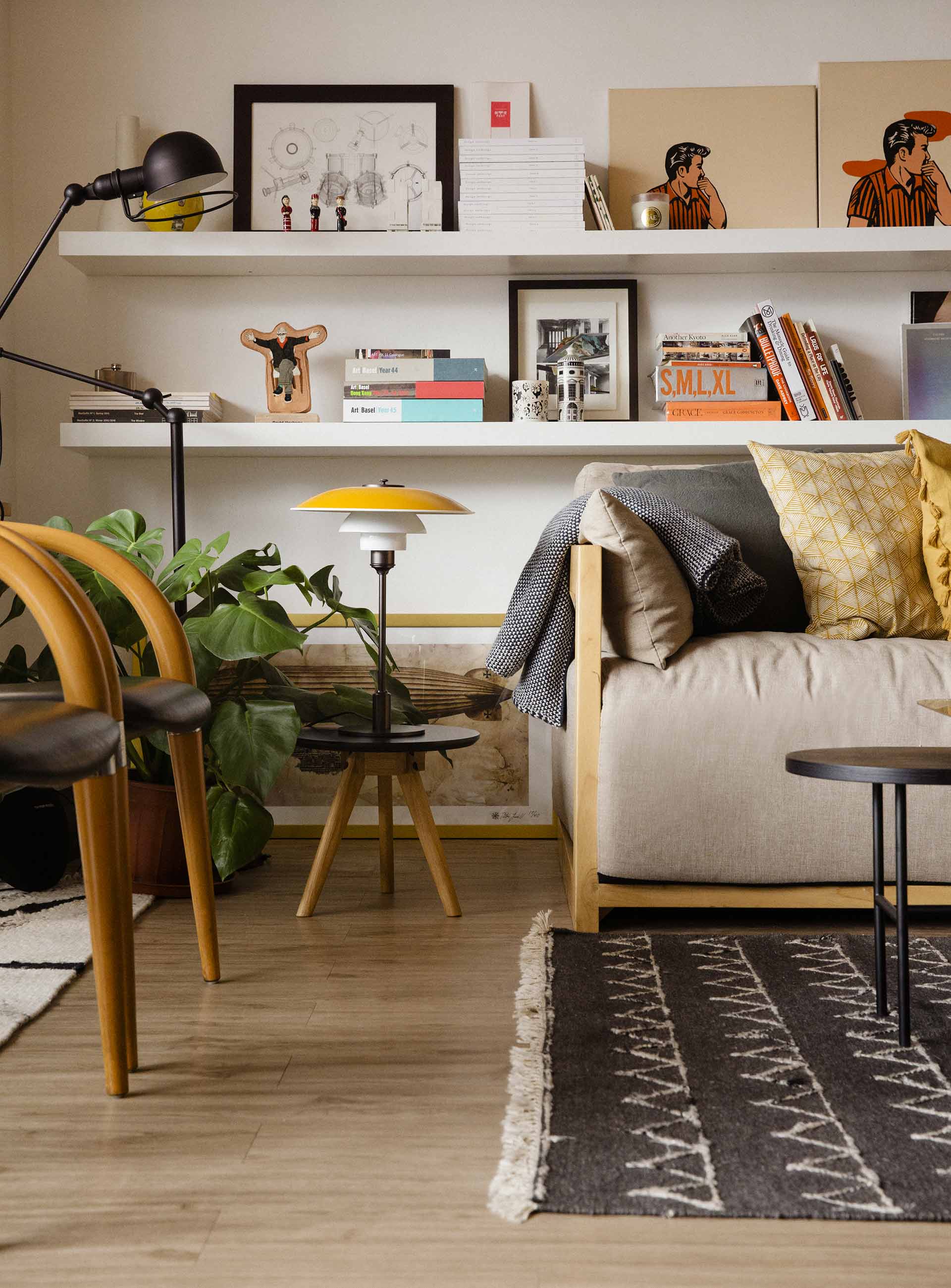 An apartment with a table lamp setting the scene and sofa