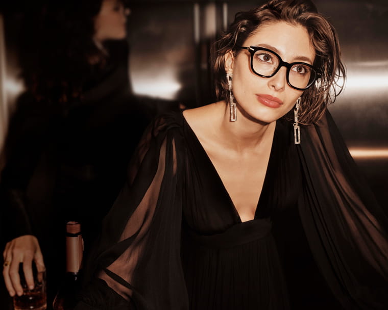 A model wearing Linda Farrow D-frame glasses from the Linear collection