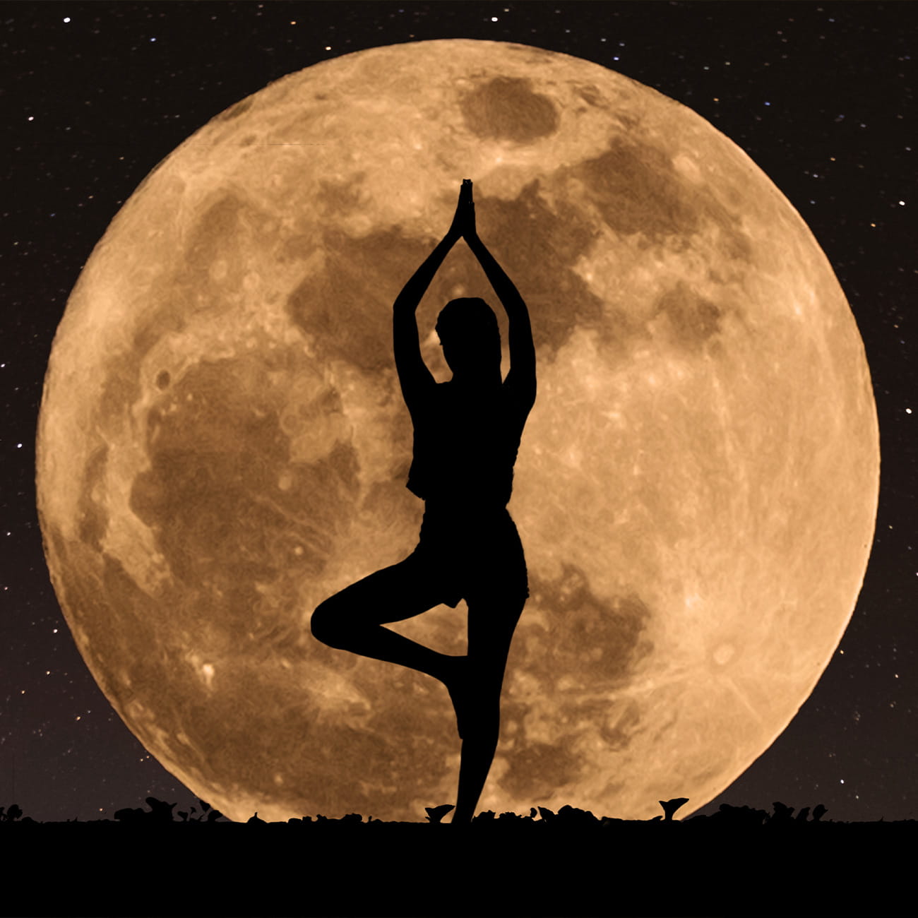 A woman doing yoga in front of a full moon