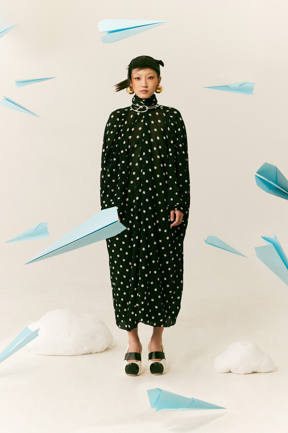 A model poses in Balenciaga, Hermès and Louis Vuitton