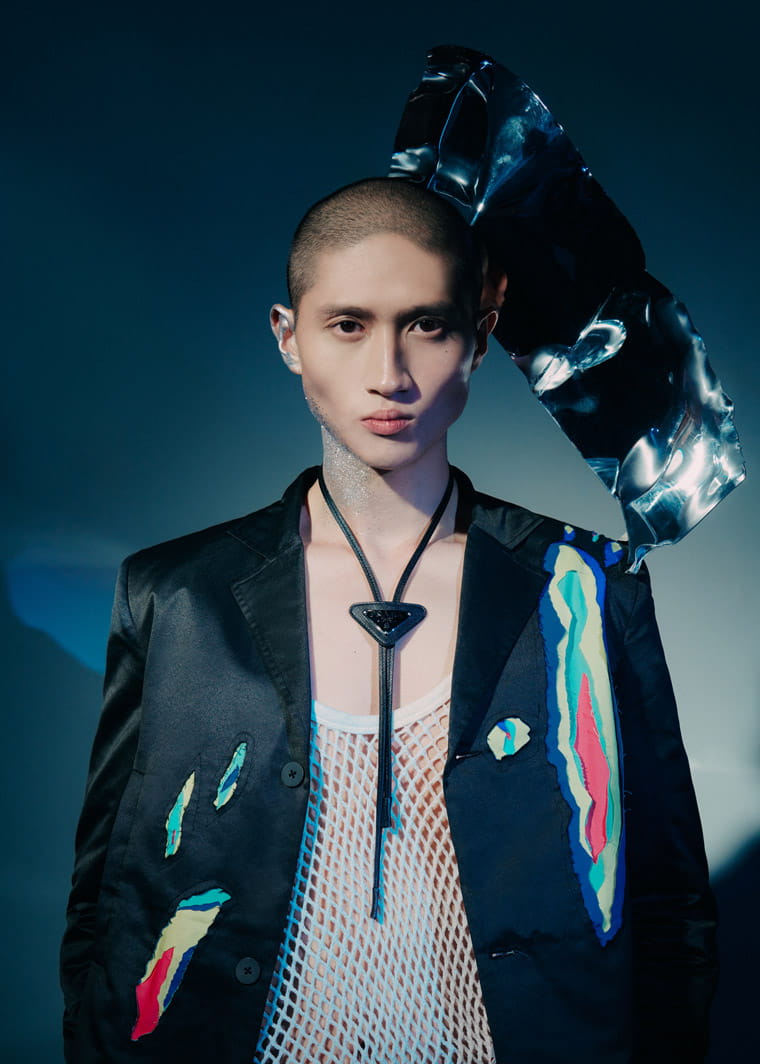 A model poses in Charles Jeffrey, Gucci and Louis Vuitton