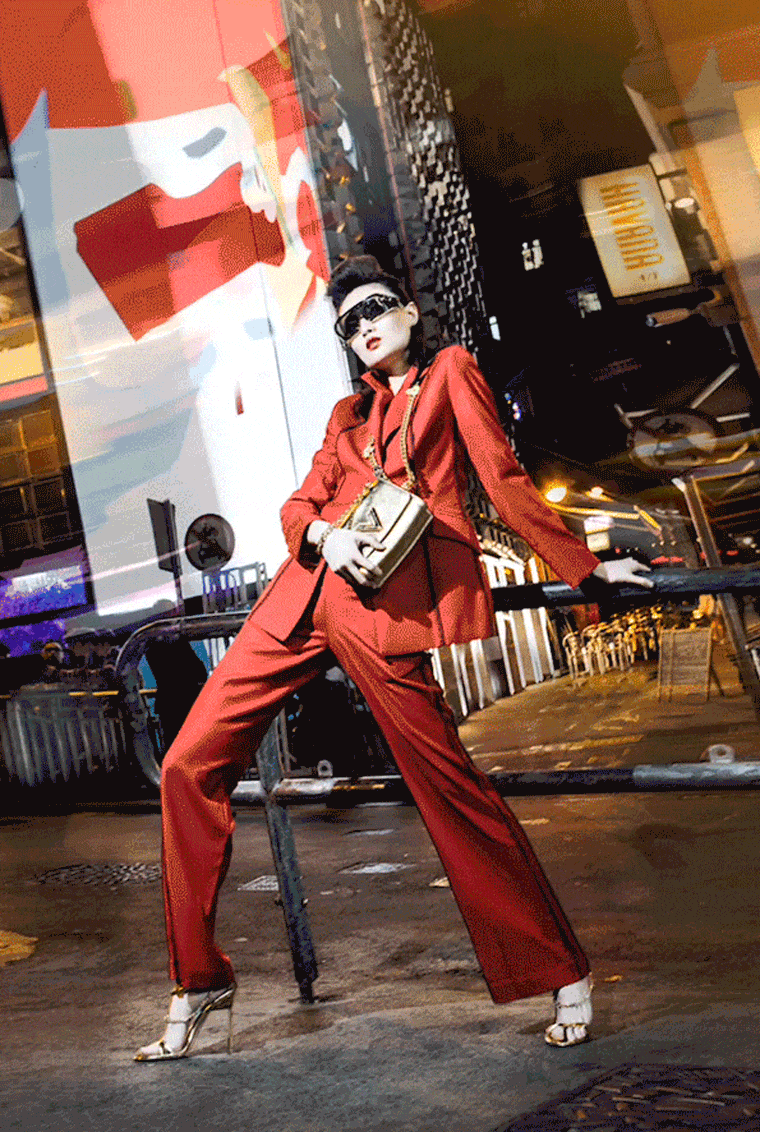A model poses in a look by Wynn Hamlyn on the streets of Hong Kong  
