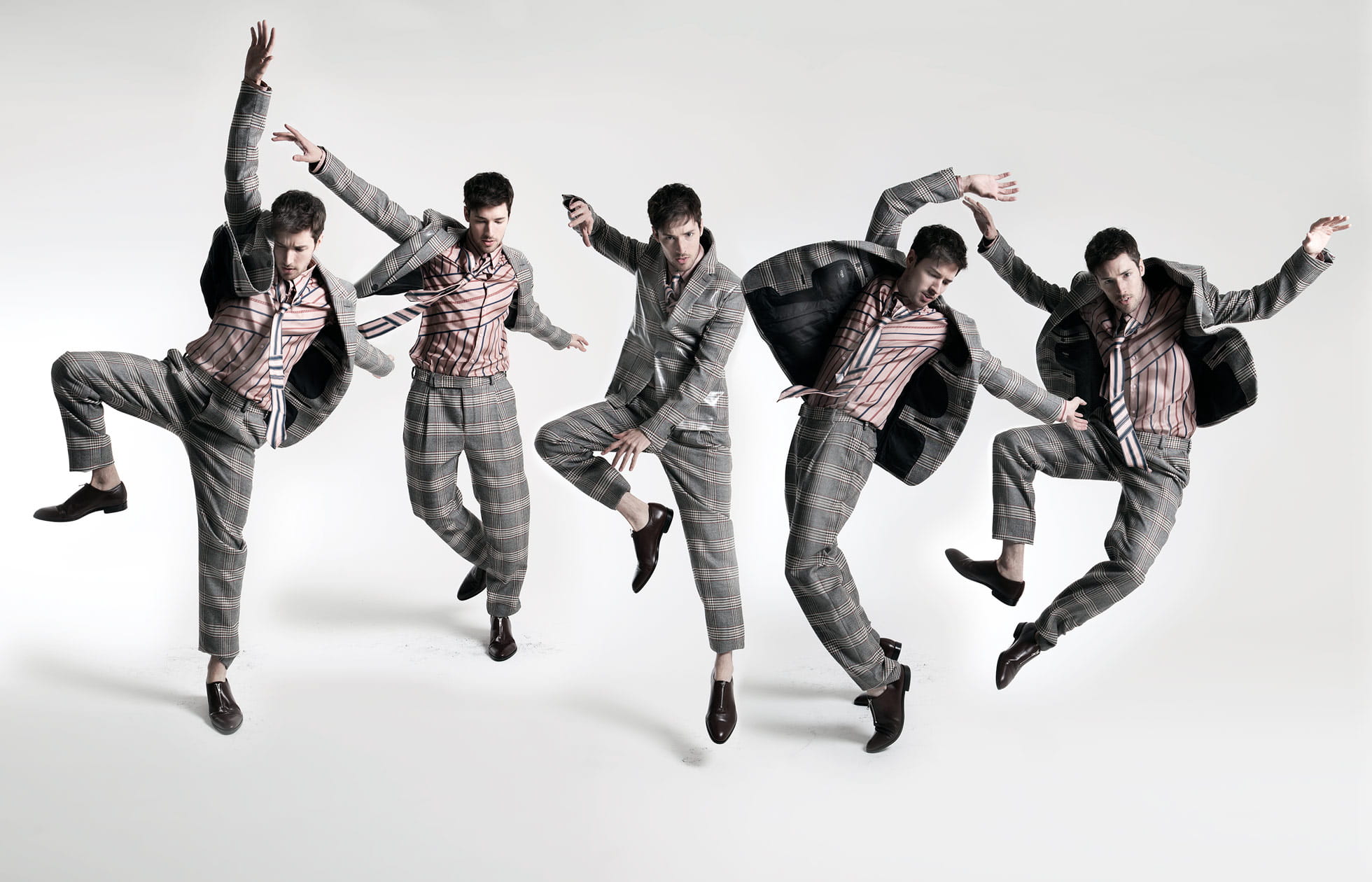 A model poses in a checked Fendi suit