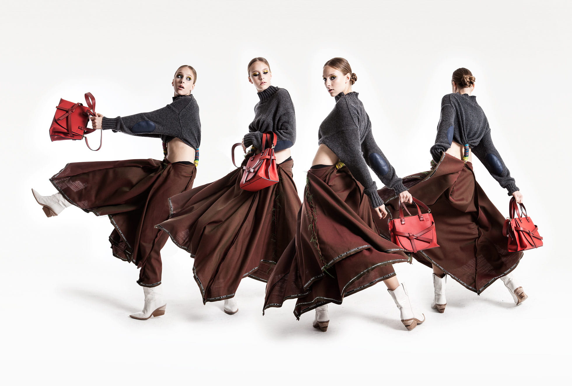 A model swings the latest Loewe bag while wearing Loewe and Fendi