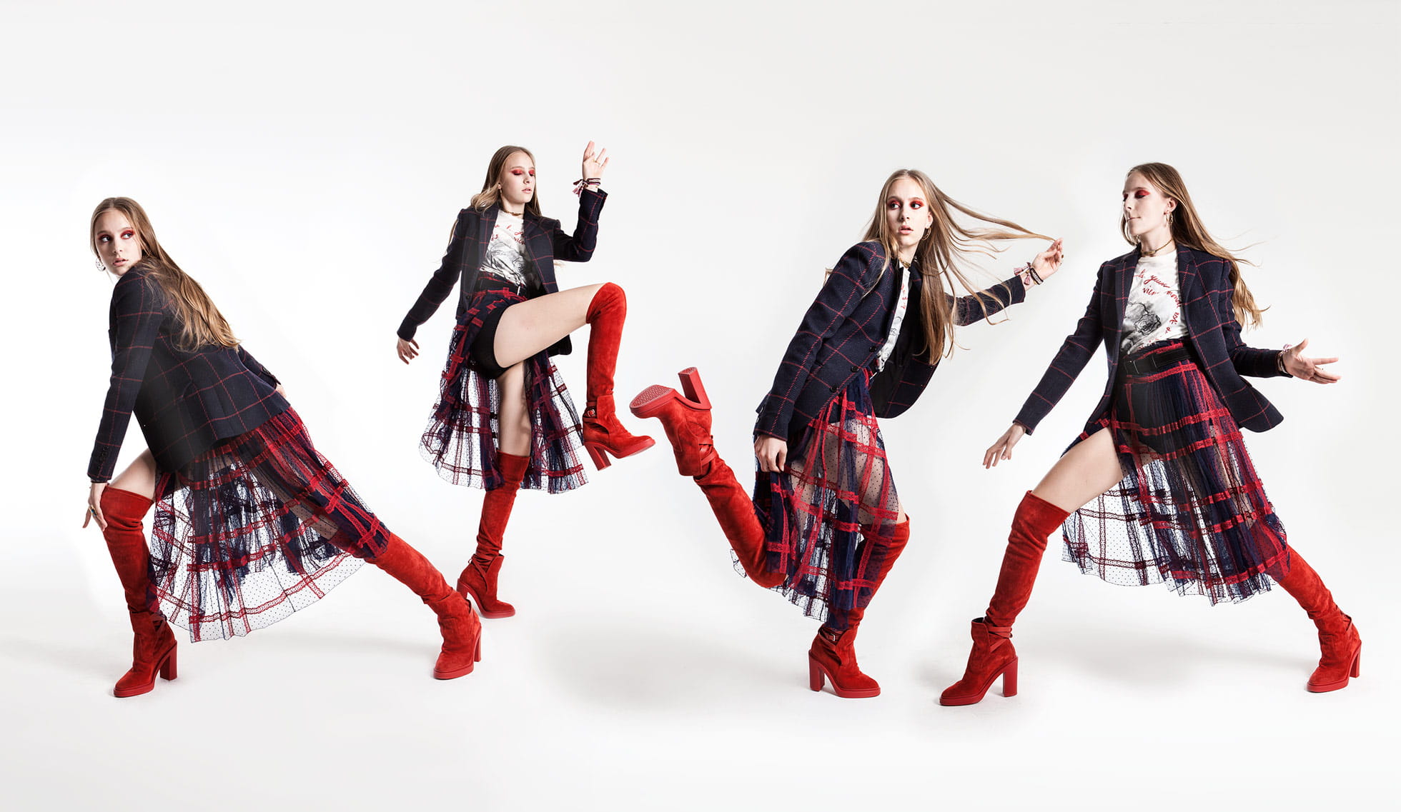 A model poses in a look from Christian Dior finished with red Hermès thigh-high boots