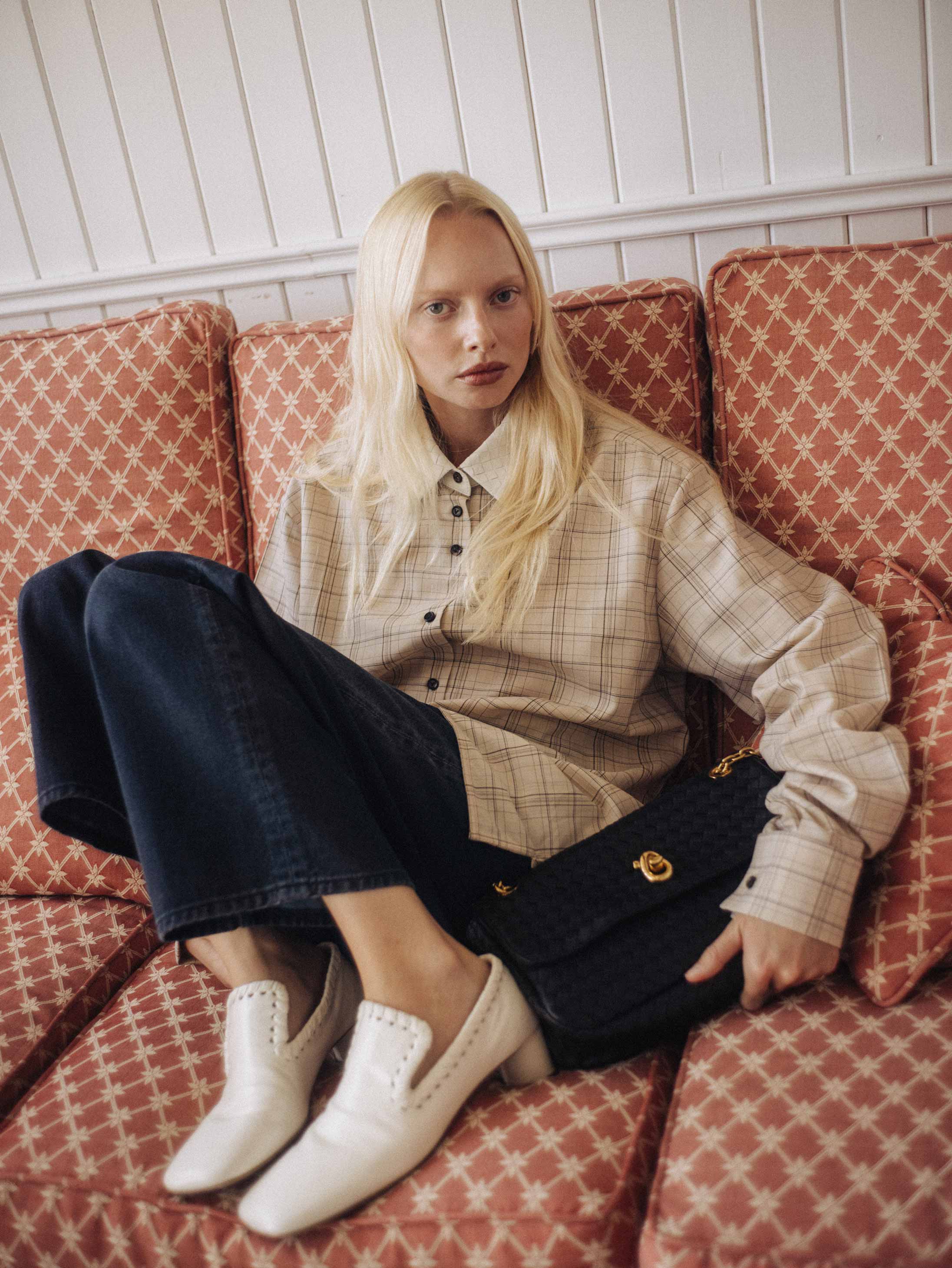 A model poses in Norfolk wearing Bottega Veneta