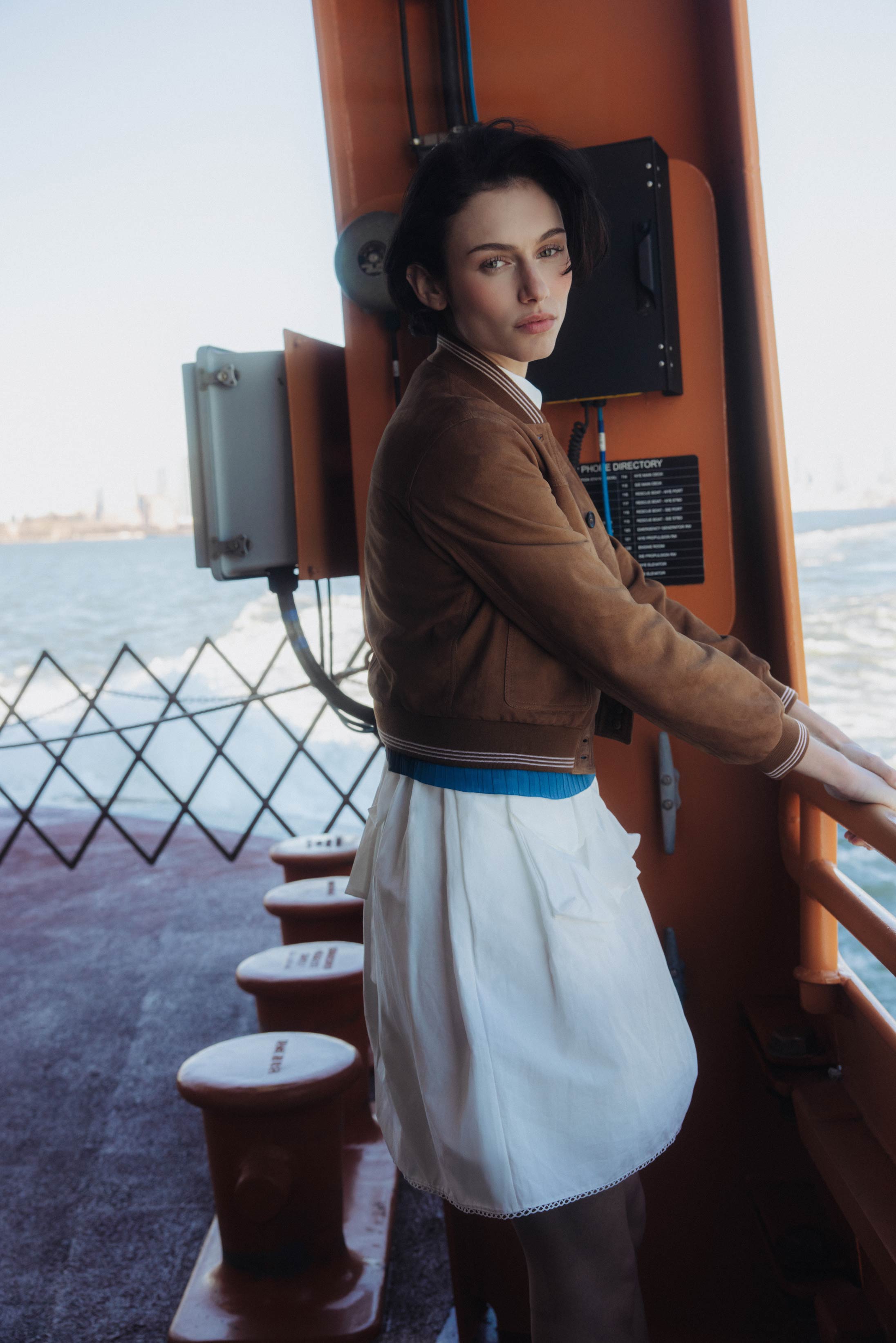 A model poses on the Staten Island Ferry in Miu Miu