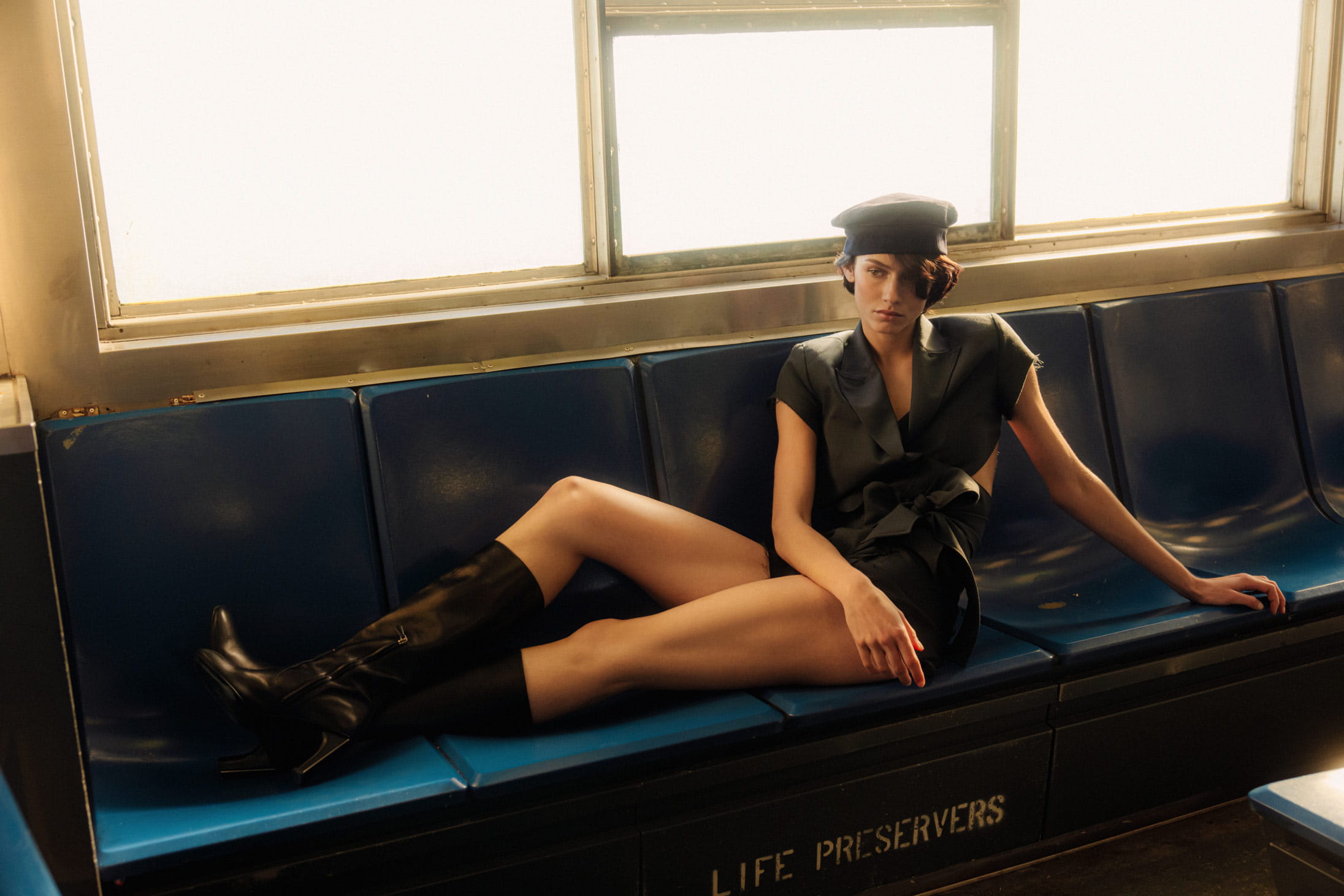 A model poses on the Staten Island Ferry in MAX&Co. and Hermès