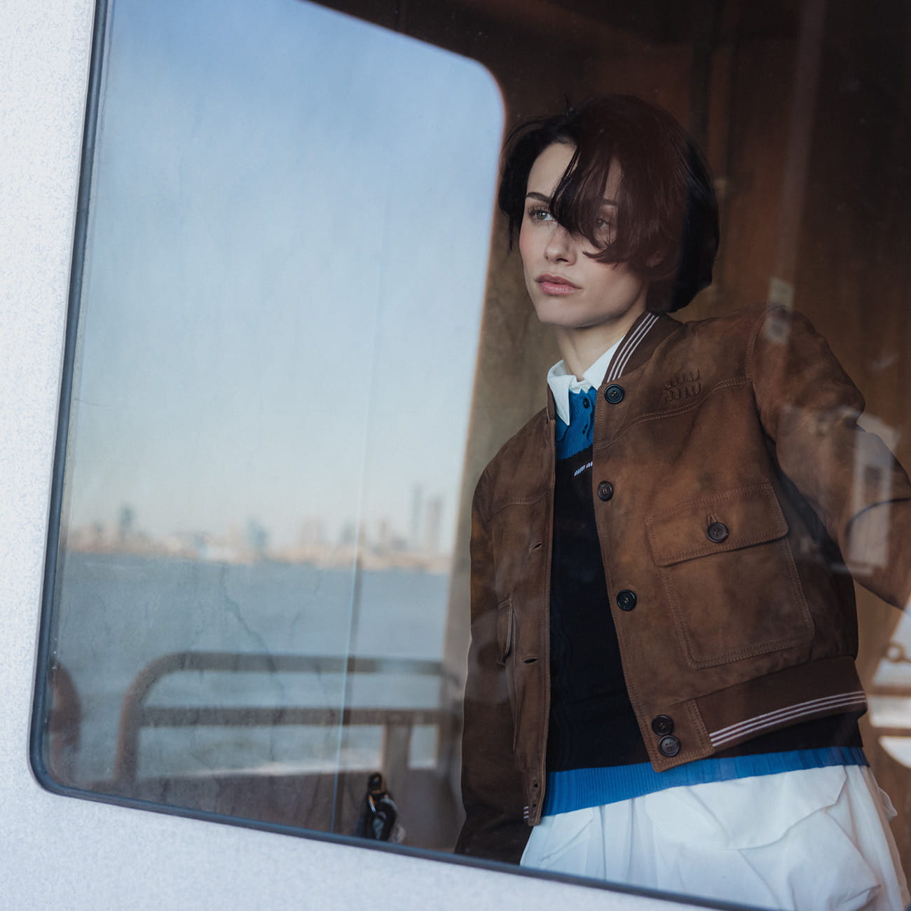 A model poses on the Staten Island Ferry in Miu Miu