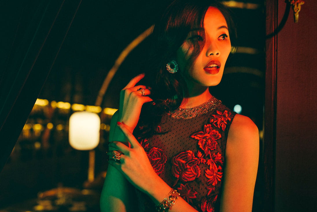 A model wears an unabashed evening dress laden with flower embroidery