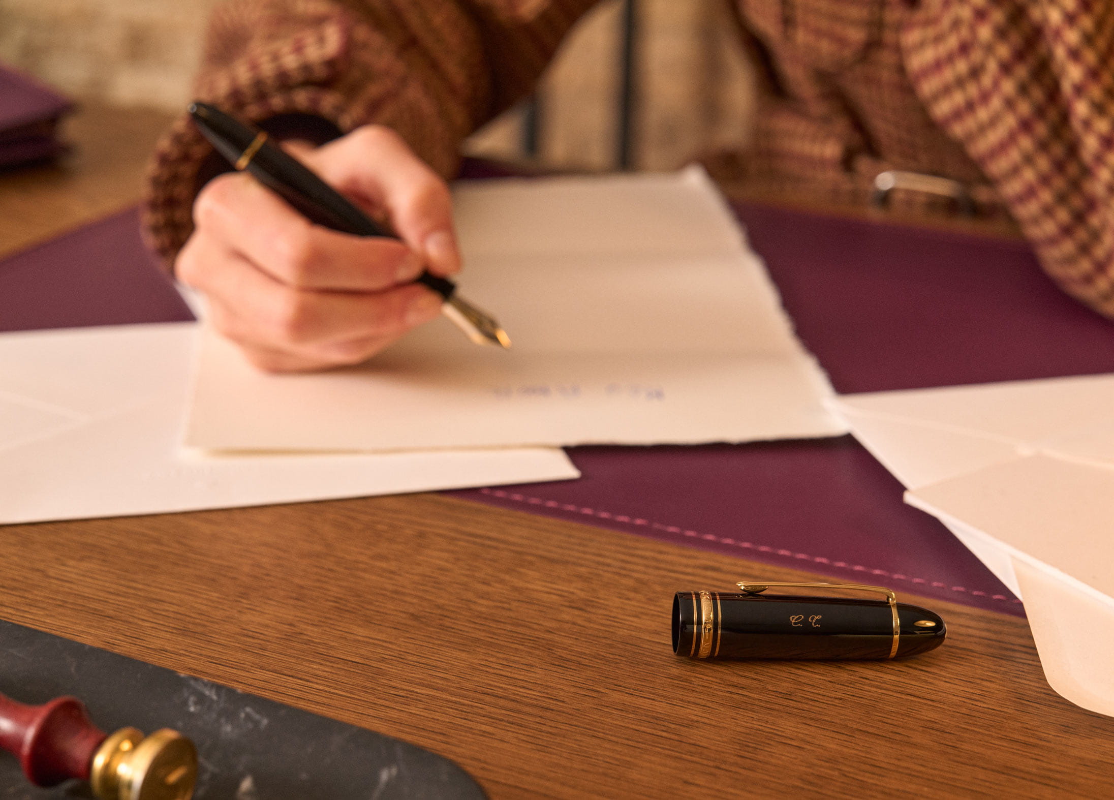 A woman journalling with a Montblanc pen