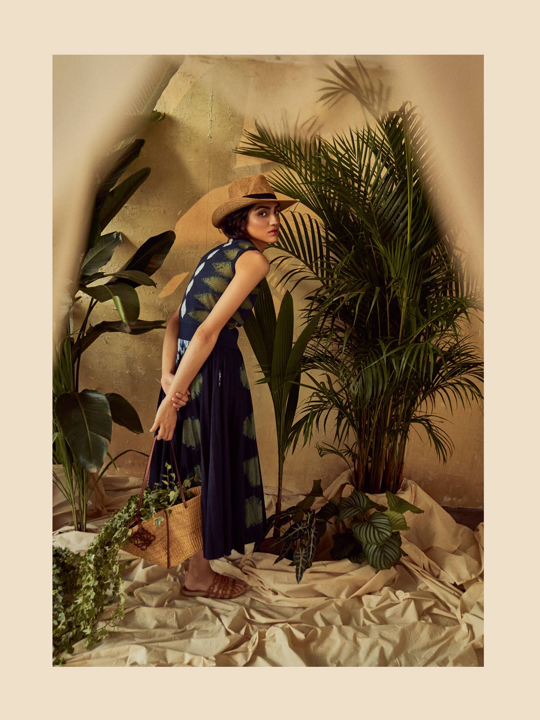 A model poses in Dior, Hermes and Loewe