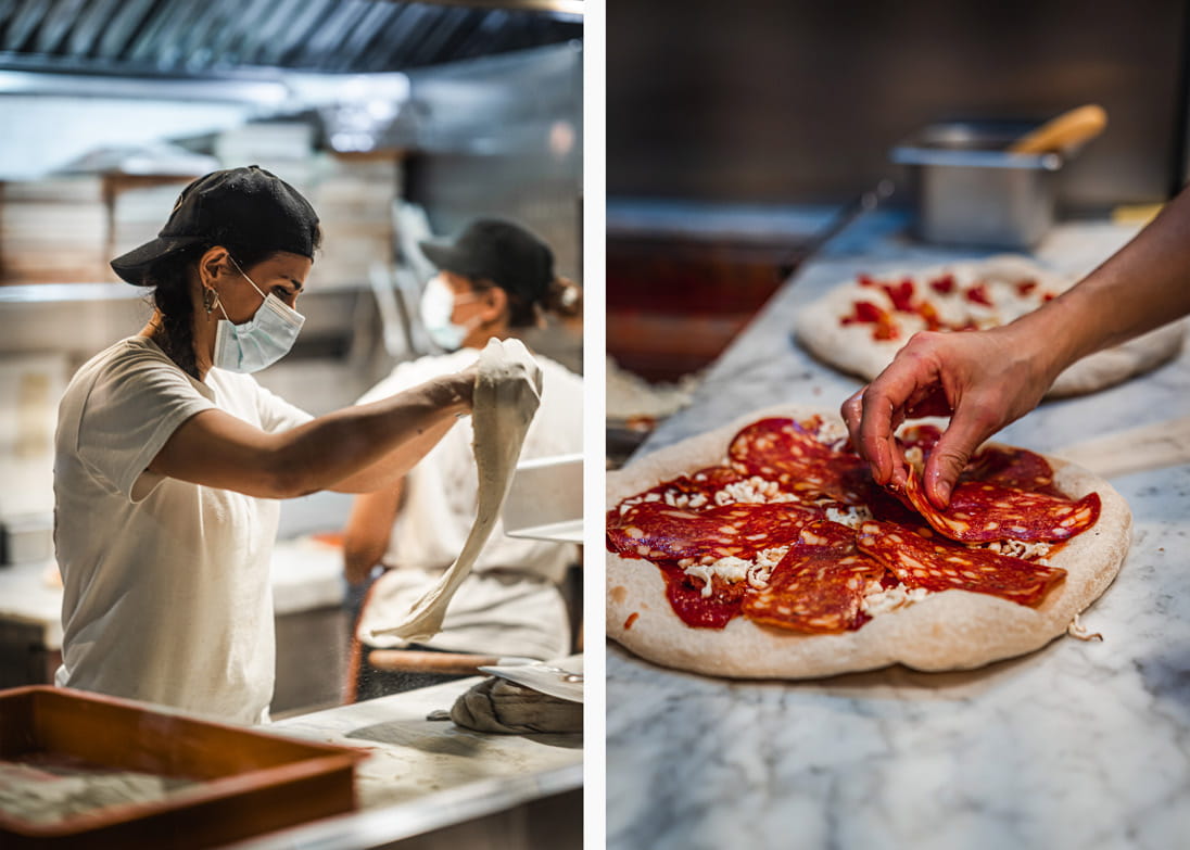 Kitchen staff at The Pizza Project prepare pizza
