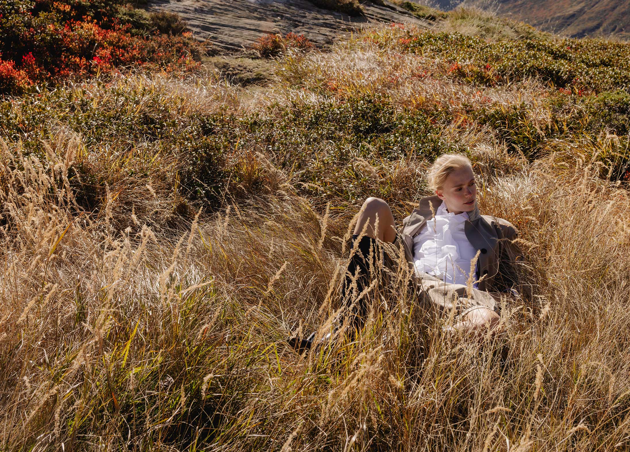 A model poses in the Swiss Alps wearing Dior