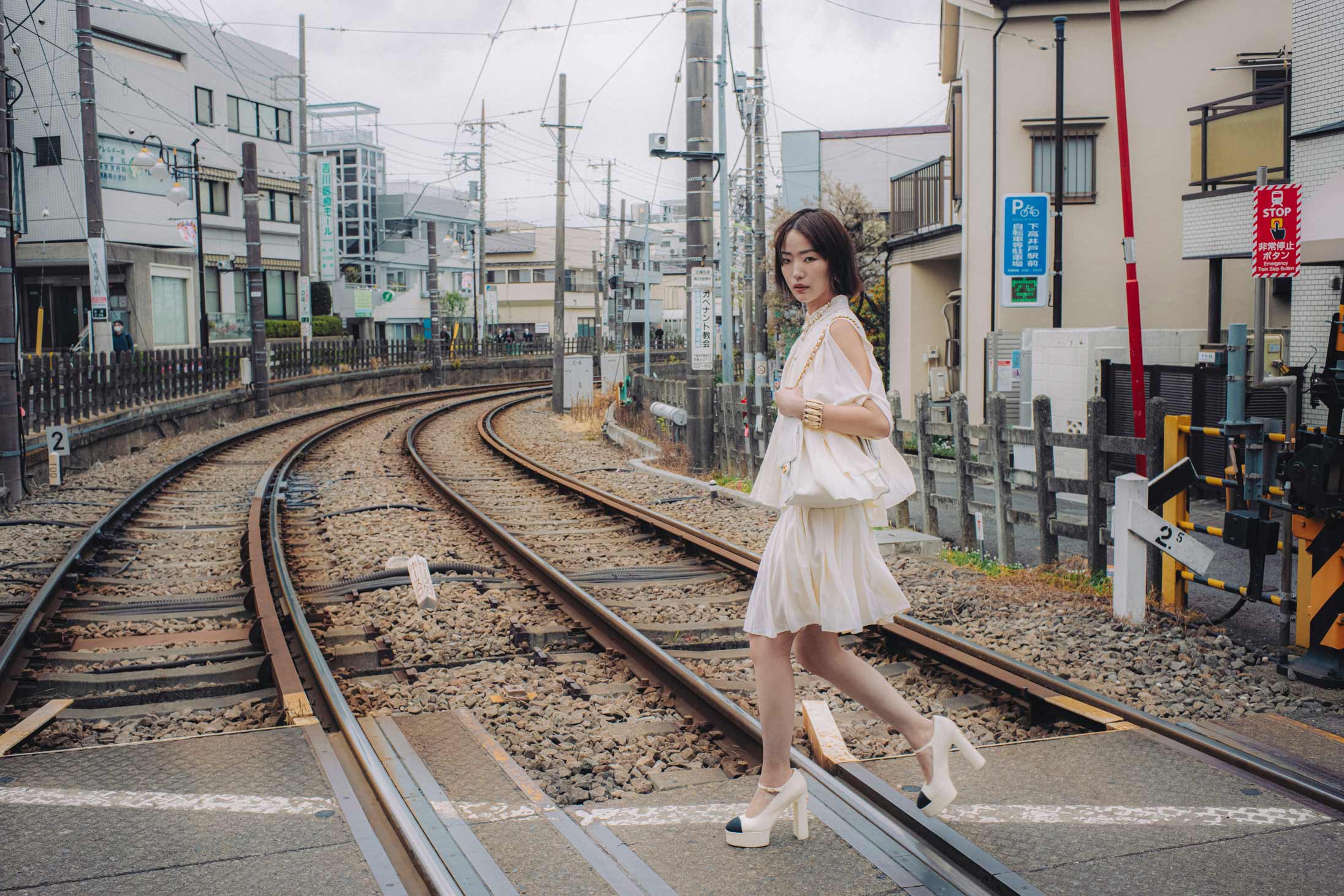 A model poses in Tokyo wearing Chanel