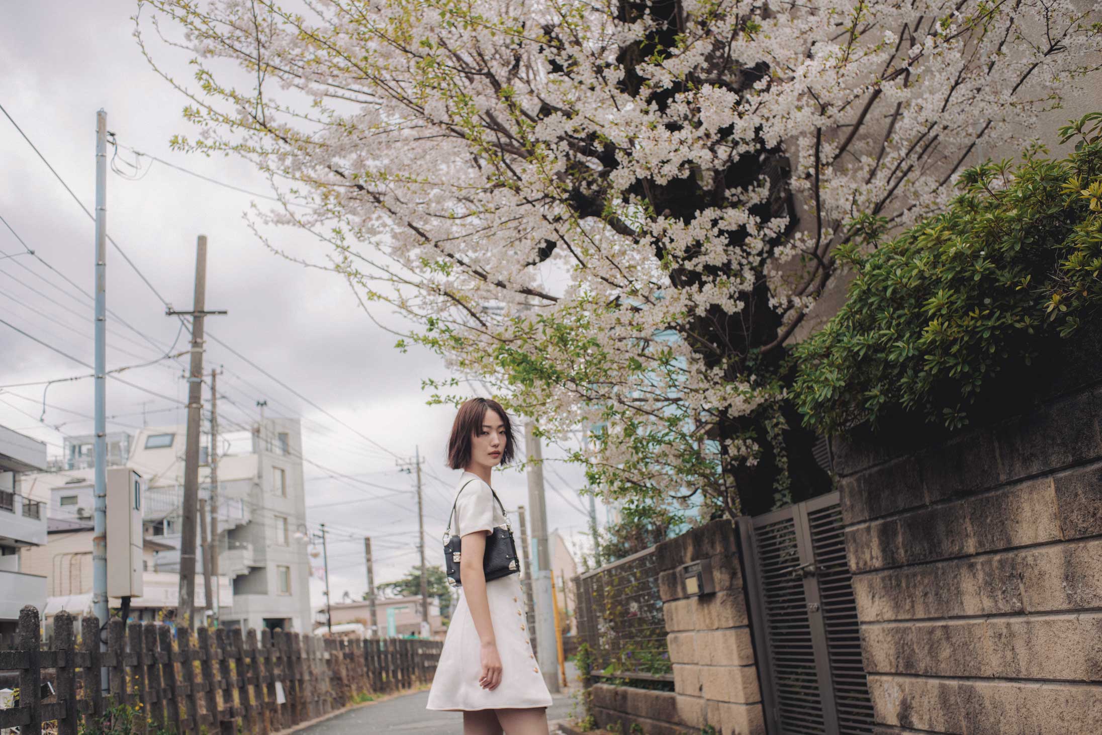 A model poses in Tokyo wearing Louis Vuitton