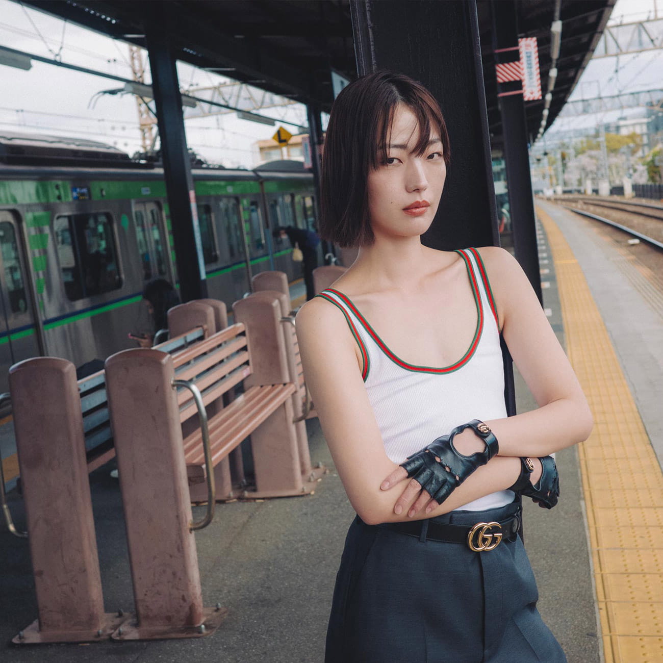 A model poses in Tokyo wearing Gucci