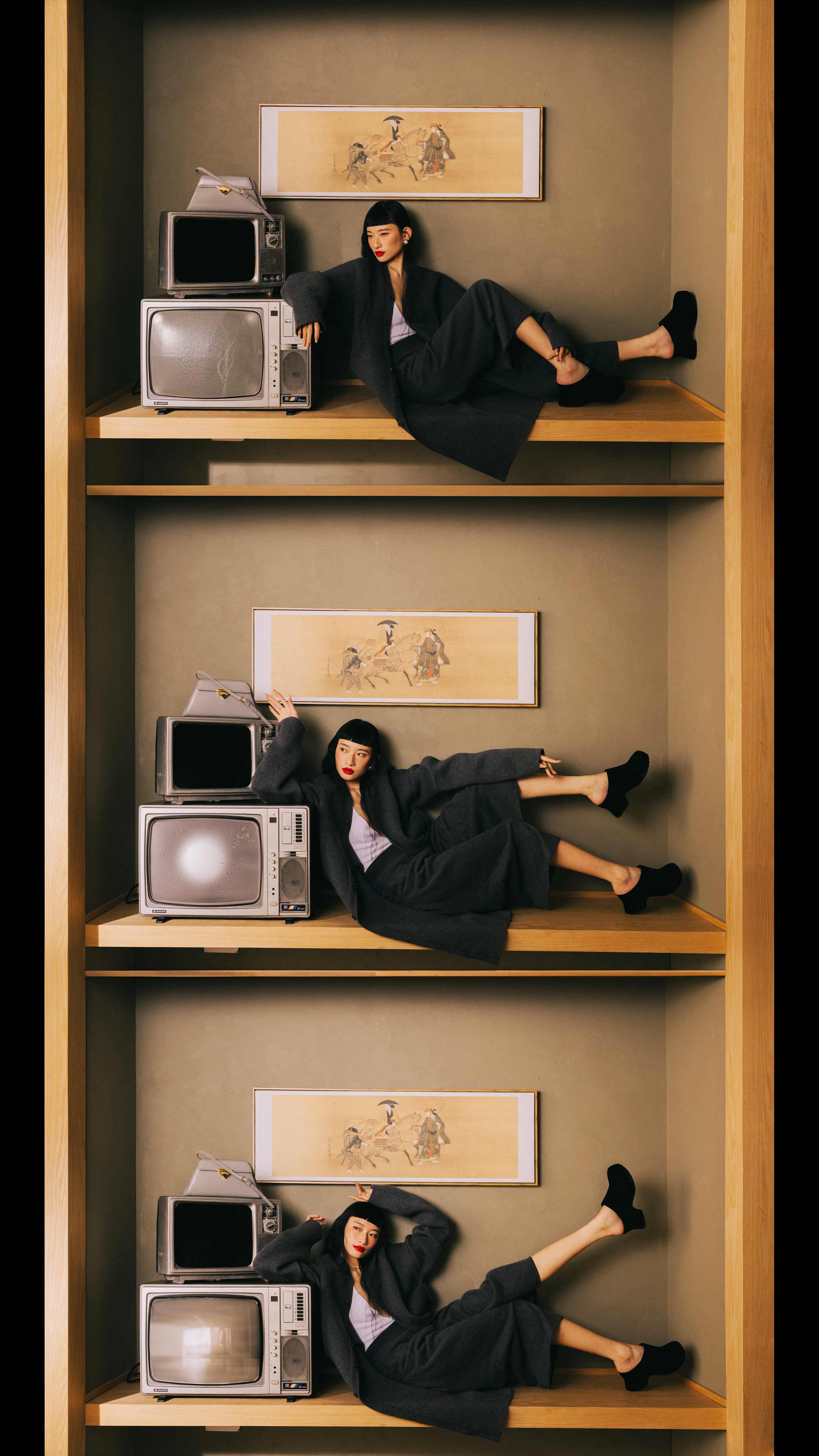 A model poses in Ferragamo, LOEWE and Prada